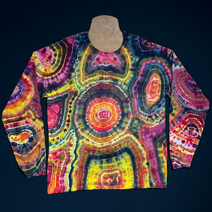 Front side of a pink, black & yellow agate geode reminiscent ice tie-dyed long sleeve shirt design; laid flat on a solid black background