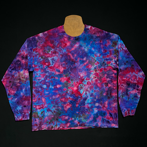 A finished long sleeve cloud 9 marbled ice tie-dyed design; laid flat on a solid black background.
