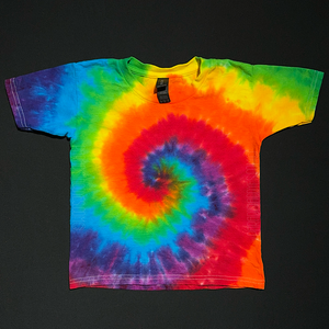 A rainbow spiral short sleeve tie dye t-shirt featuring Pride flag colors, laid flat on a solid black background.