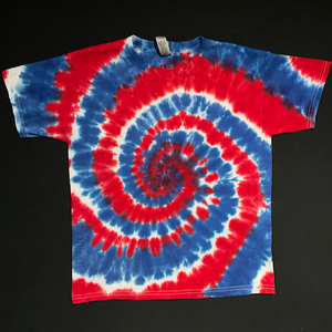 Youth size short sleeve tye dye t-shirt featuring a red, white and blue, American flag colored, spiral design.