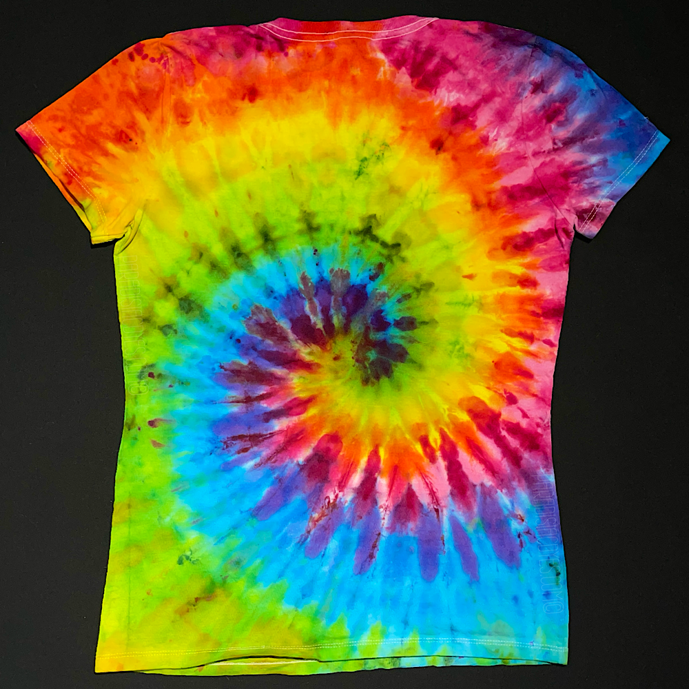 Back side of a rainbow spiral ice tie-dyed v-neck tee featuring shades of: pink, orange, yellow, green, blue & purple; laid flat on a solid black background