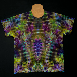 Front side of a Psychedelic Mindscape ice tie dyed shirt design in a Halloween themed green & purple color scheme; featuring an abstract, symmetrical, totem pole reminiscent pattern