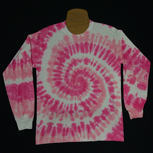 Front side of a bubblegum pink spiral long sleeve tie dye shirt