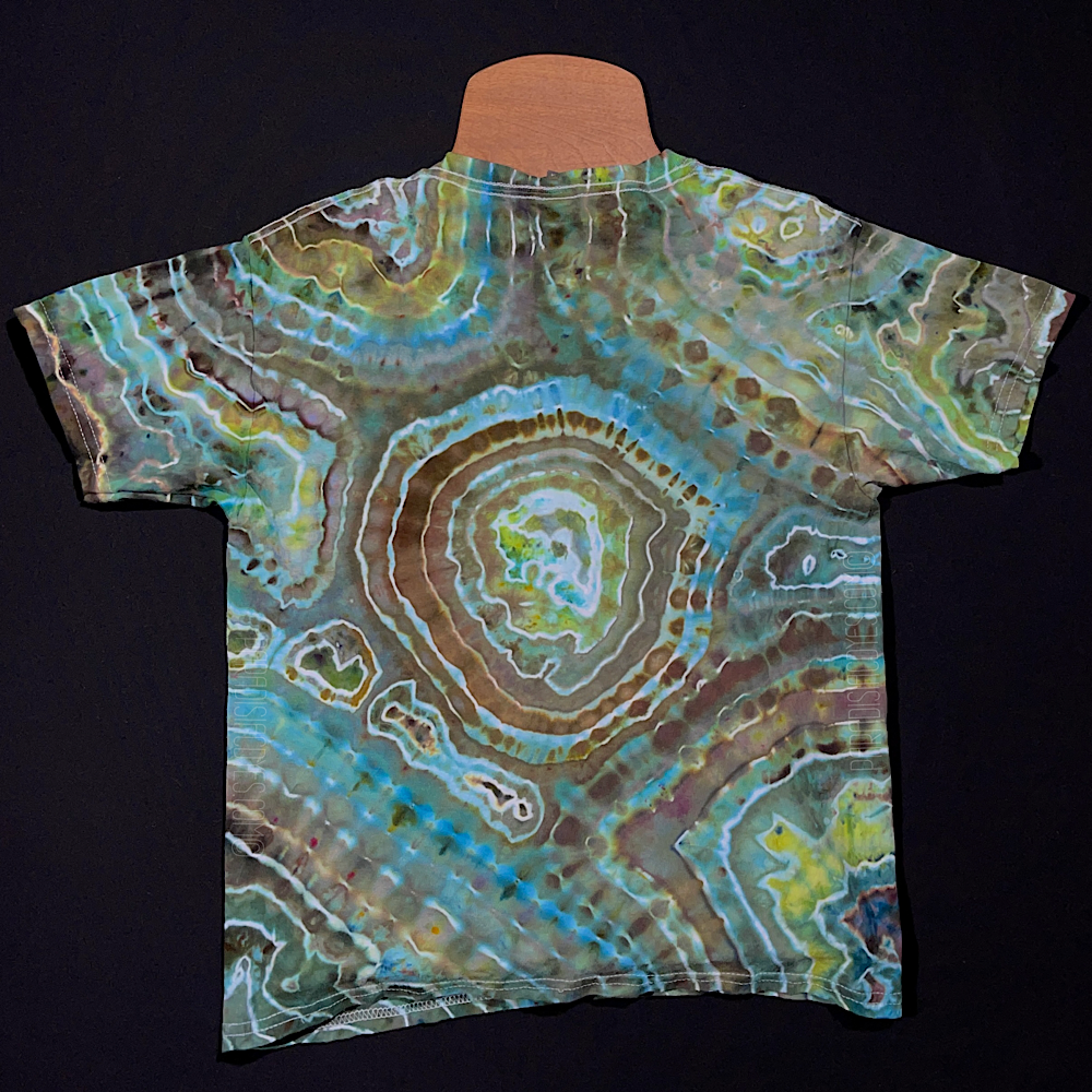 Front side of a youth size medium agate geode ice dye design t-shirt featuring mint, seafoam and seaglass jewel-toned shades with some brown banding