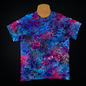 Front side of a cloud 9 marbled ice dye t-shirt, a blue, pink and purple splatter pattern