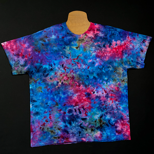 Another example of a different cloud 9 marbled ice tie-dyed shirt design; laid flat on a solid black background 