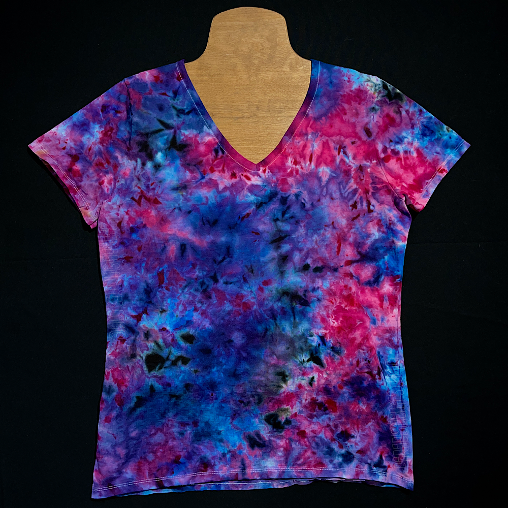 Front side of a Cloud 9 marbled ice tie-dyed design on a ladies' Fruit of the Loom HD cotton v-neck style t-shirt; laid flat on a solid black background
