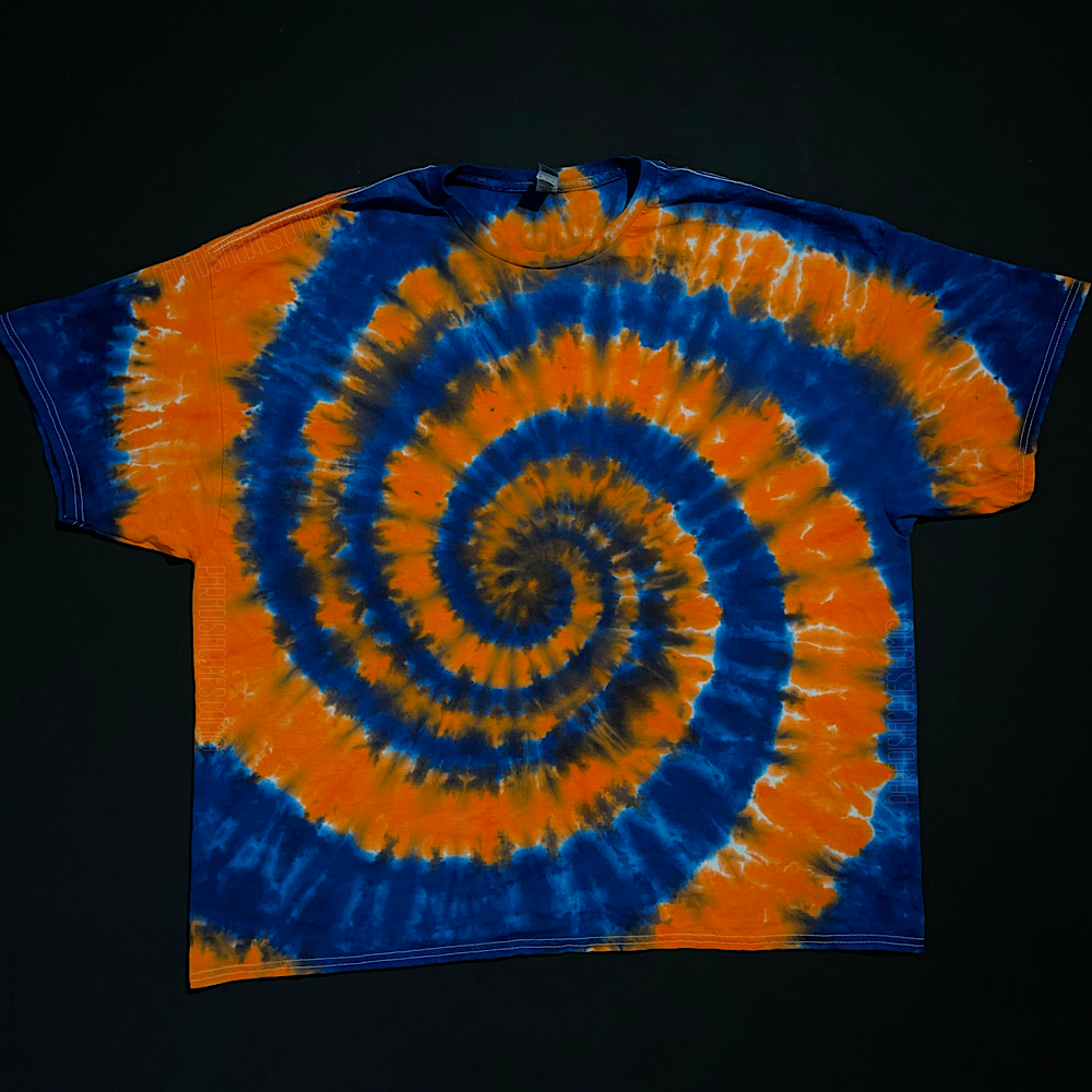 Front side of a Detroit Tigers colors spiral tie dye t-shirt; laid flat on a solid black background 