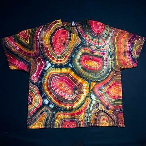 Front side of a Lavastone Geode ice tie-dyed t-shirt design; which boasts an array of black, pink & yellow shades, and a distinctly unique pattern on each side of every geode pattern tee