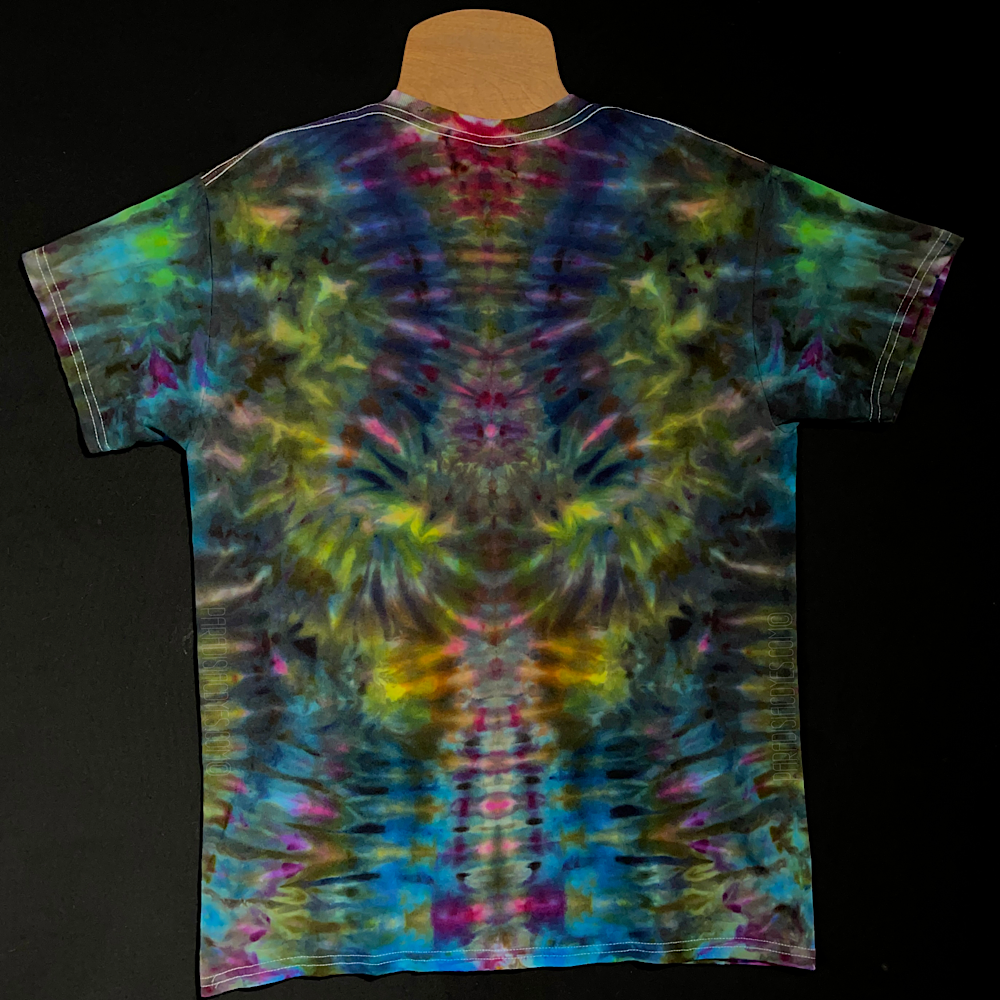 Back side of the same size medium neon rainbow psychedelic mindscape ice dye t-shirt design; laid flat on a solid black background
