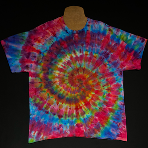 Another, different Rainbow Confetti Ice Dye T-Shirt design, a (primarily pink) rainbow color scheme in a classic spiral design