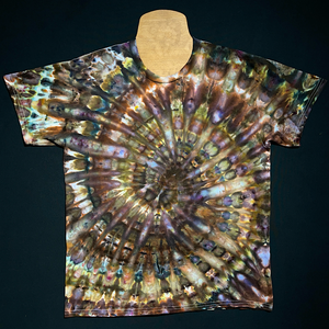 An earthy, natural toned short sleeve shirt with an array of browns & grays, featuring an ice tie-dyed spiral design.