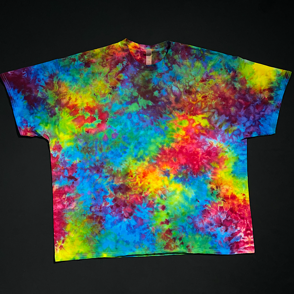 Another, different Melted marbled rainbow short sleeve ice tie-dyed shirt; laid flat on a solid black background