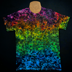 An example of another finished Midnight Marbled Rainbow Ice Dye T-Shirt, a rainbow splatter pattern with black detailing