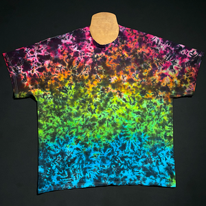 Another finished Midnight Marbled Rainbow Ice Dye T-Shirt. The "base" of this design features a Marbled gradient of: pink, orange, fluorescent yellow, lime green & blue from top to bottom, with black splatter pattern detailing on top.