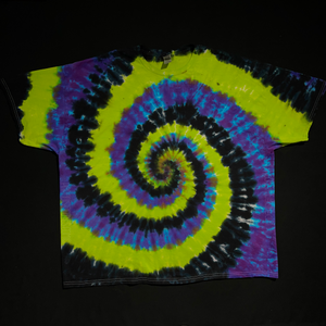 Another example, featuring a different Black, Green & Purple Spiral Tie Dye T-Shirt design before shipping; laid flat on a solid black background