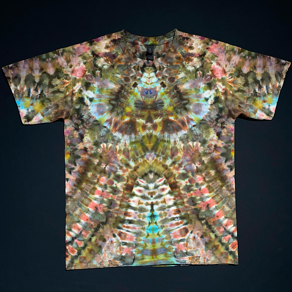 Abstract, symmetrical ice tie-dyed t-shirt with an earthy, camouflage-esque color scheme; laid flat on a solid black background.