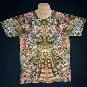 Short sleeve tee featuring earthy, neutral shades in an abstract, symmetrical, totem pole reminiscent pattern.