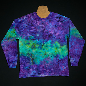 Front side of a different, finished Purple & Mint Green Marbled Ice Dye Splatter Long Sleeve Shirt design; laid flat on a solid black background before shipping