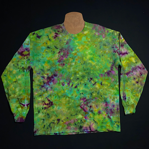 An example of a finished, one-of-a-kind, hand-dyed, weed bud inspired long sleeve ice tie-dyed shirt design; laid flat on a solid black background 