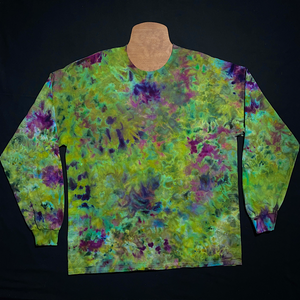 Another example of a different, finished weed bud inspired green & purple marbled ice dye splatter long sleeve shirt; laid flat on a solid black background 