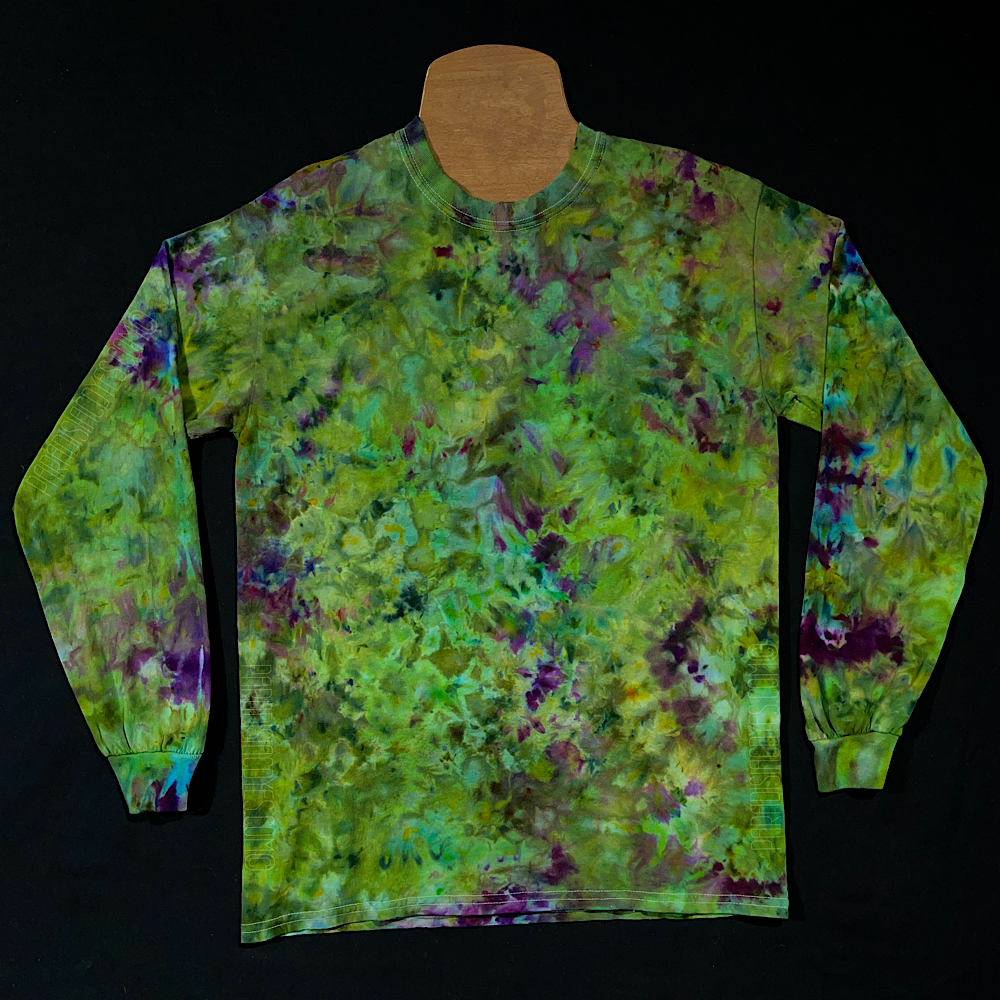An example of a finished, one-of-a-kind green & purple weed bud inspired ice tie-dyed long sleeve shirt design; laid flat on a solid black background 