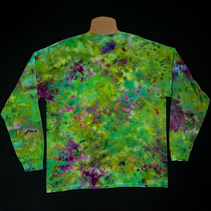 Back side of a finished, one-of-a-kind, weed bud inspired long sleeve ice tie-dyed shirt design featuring an array of green shades, with hints of purple veining throughout; laid flat on a solid black background 