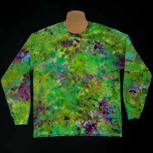 Front side of a finished, one-of-a-kind, weed bud inspired long sleeve ice tie-dyed shirt design; laid flat on a solid black background 