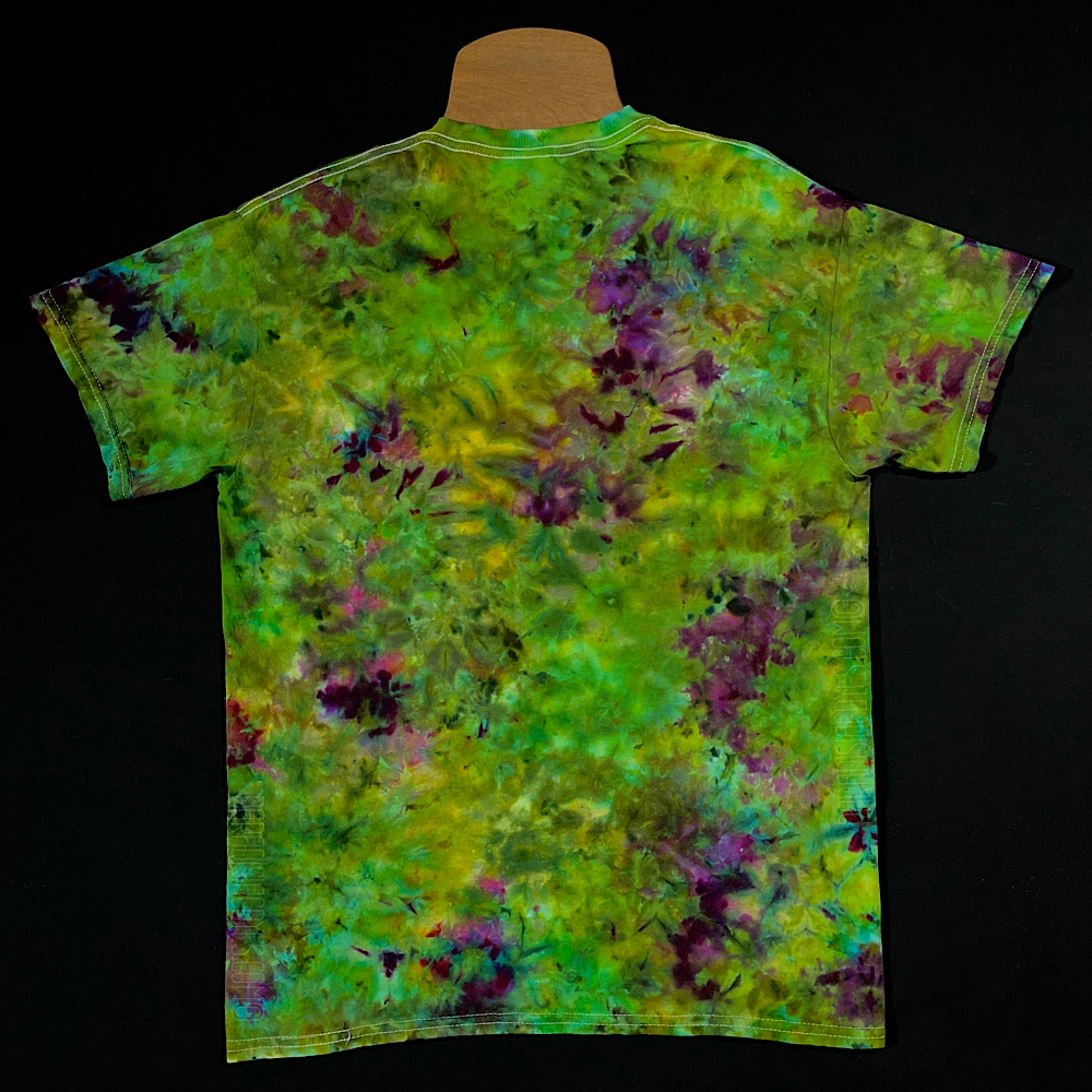Back side of a green & purple weed bud inspired marbled ice dye pattern t-shirt; laid flat on a solid black background