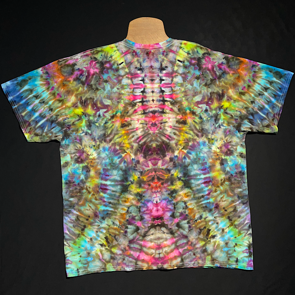 Front side of an abstract, symmetrical ice tie-dyed design featuring a vibrant pink-rainbow color scheme atop one-of-a-kind, pareidolia-inducing pattern.