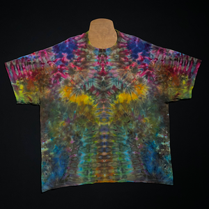 Front side of an abstract, symmetrical ice tie-dyed t-shirt design featuring a muted, rustic rainbow color scheme