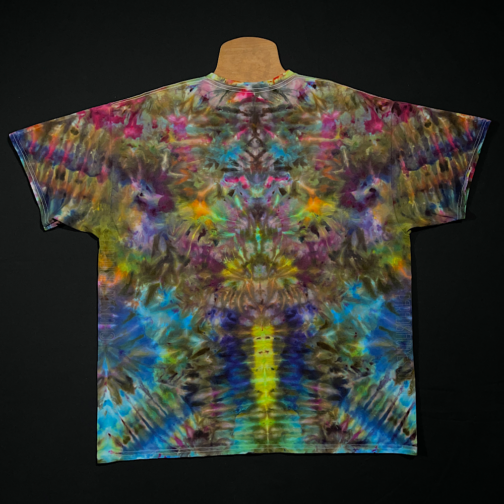 Front side of a size adult 2XL vibrant, multi-color, abstract, symmetrical ice tie-dyed t-shirt design; laid flat on a solid black background