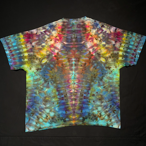 Back side of a hand-dyed, one-of-a-kind, abstract, symmetrical Psychedelic Mindscape ice tie-dyed design on a short sleeve size adult XXL tee; laid flat on a solid black background.