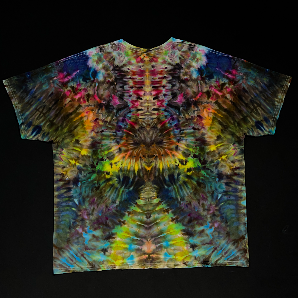 Front side of a vibrant rainbow colored abstract, symmetrical, Psychedelic Mindscape short sleeve t-shirt design; laid flat on a solid black background 