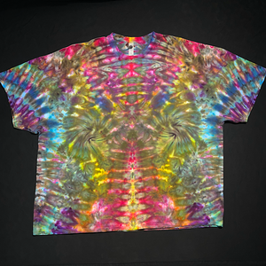 Front side of an abstract, symmetrical Psychedelic Mindscape ice tie-dyed design featuring rainbow colors in a totem pole reminiscent pattern; laid flat on a solid black background.