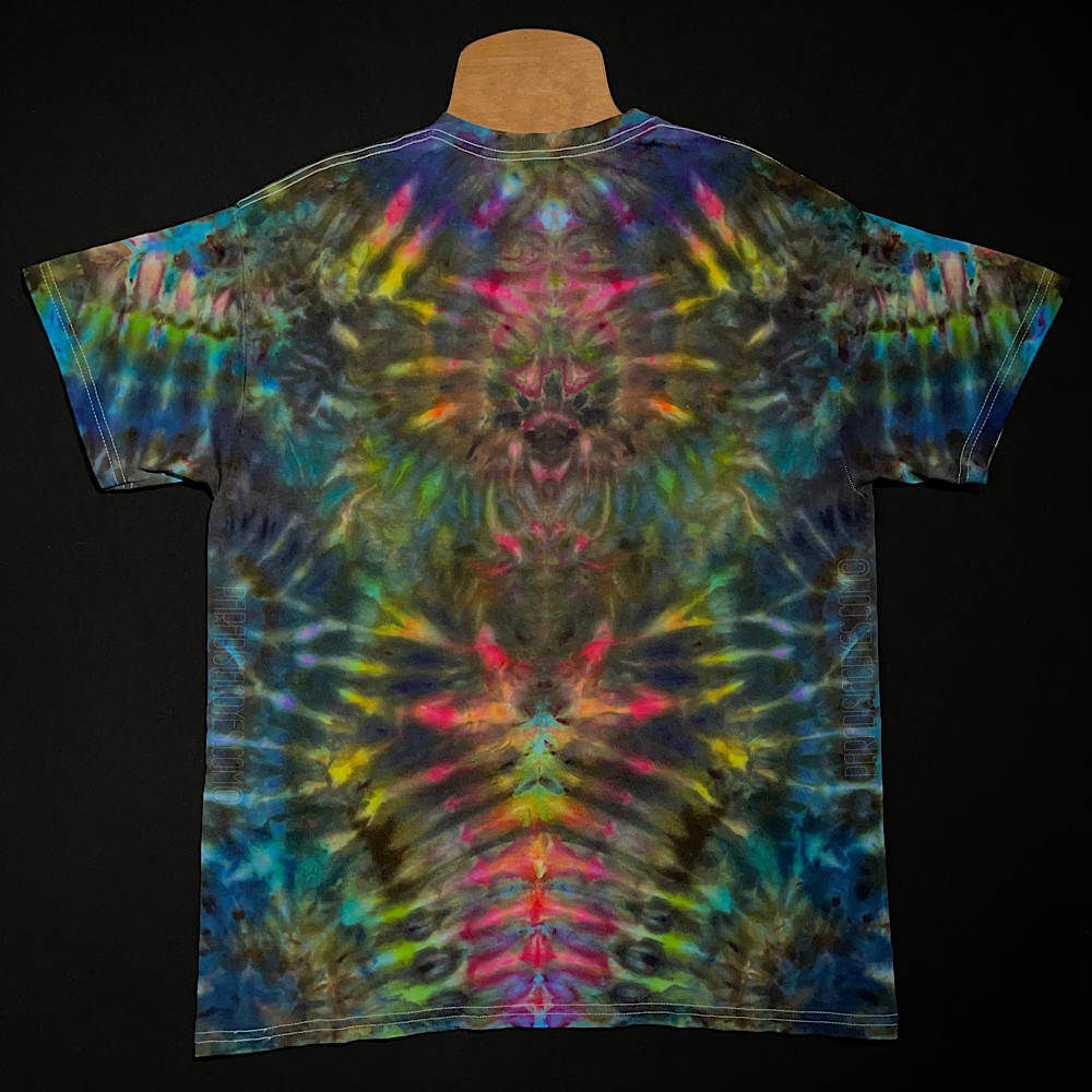 Front side of an adult large abstract, symmetrical ice tie-dyed t-shirt design. Featuring a vibrant, intense rainbow color scheme veining throughout the totem pole reminiscent pattern