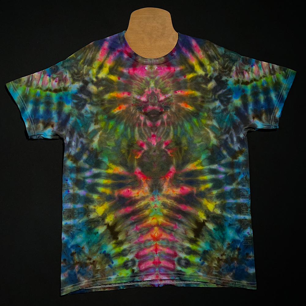 Front side of an adult large abstract, symmetrical ice tie-dyed t-shirt design. Featuring a vibrant, intense rainbow color scheme veining throughout the totem pole reminiscent pattern