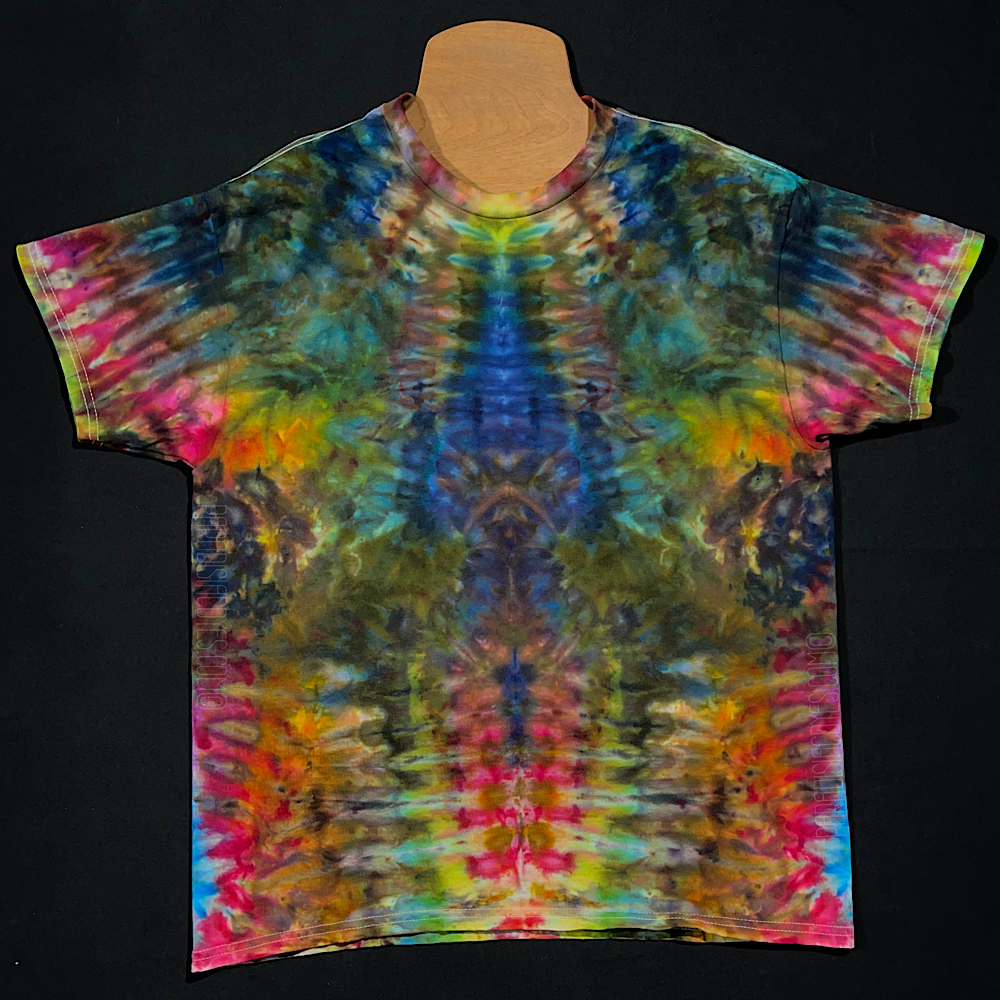 Front side of an abstract, symmetrical Psychedelic Mindscape short sleeve t-shirt design; featuring an array of muted, paler rainbow colors throughout the totem pole reminiscent pattern