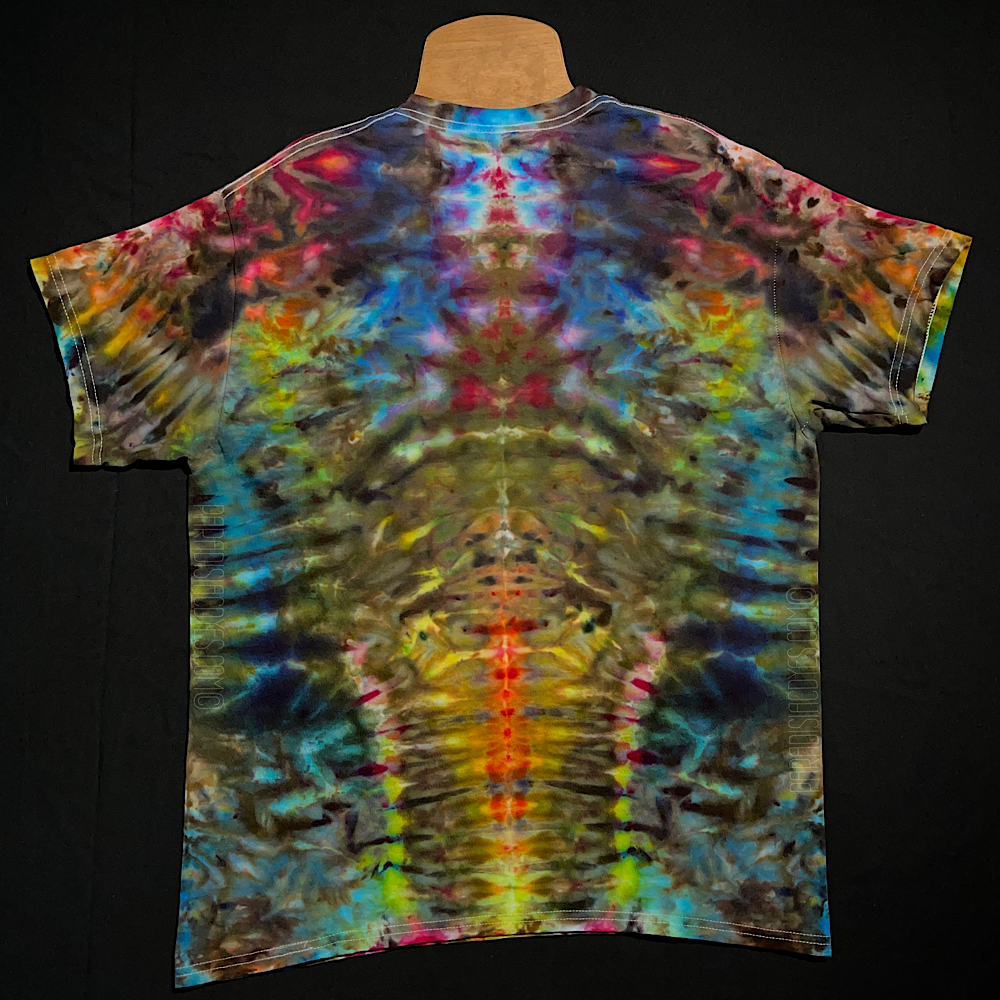 Front side of a size adult large abstract, symmetrical ice tie-dyed short sleeve shirt design; featuring vivid neon rainbow colors in a totem pole reminiscent pattern