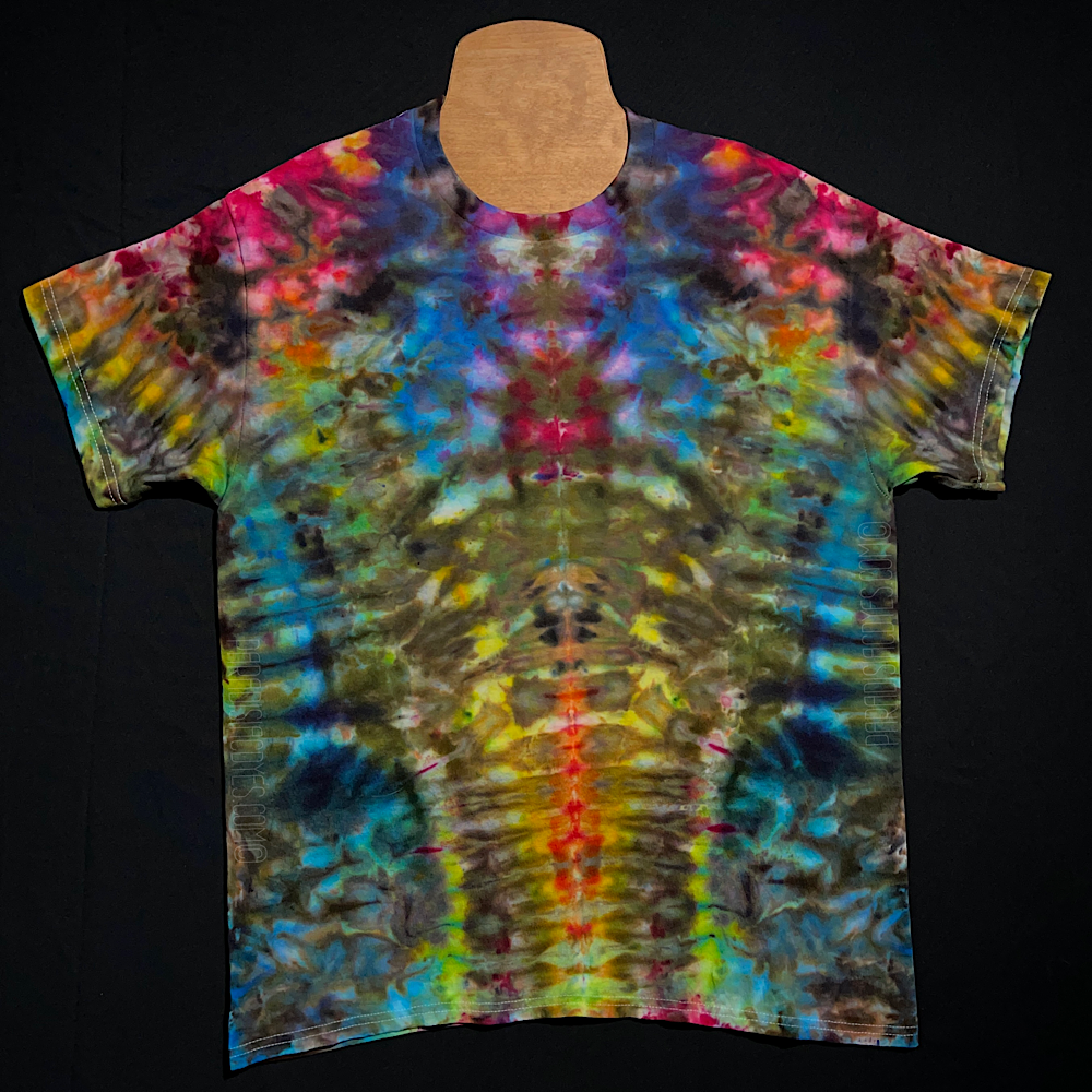Front side of a size adult large abstract, symmetrical ice tie-dyed short sleeve shirt design; featuring vivid neon rainbow colors in a totem pole reminiscent pattern