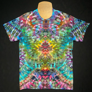 Front side of an abstract, symmetrical ice tie-dyed design featuring a captivating blue-rainbow color scheme on a totem pole reminiscent pattern.