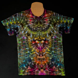 Front side of a multi-colored, dark, intense rainbow psychedelic mindscape ice tie-dyed t-shirt design; laid flat on a solid black background 