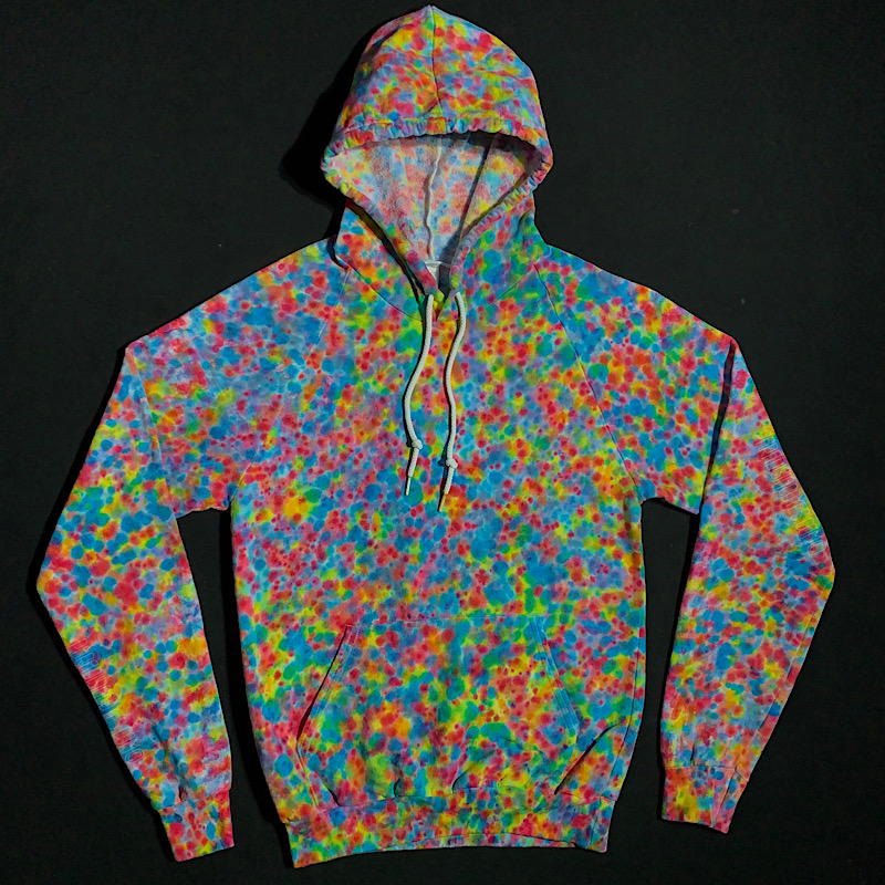 Size adult small American Apparel California fleece pullover hoodie featuring a rainbow splatter tie dye design. Paint spatter reminiscent speckled pattern that looks like a bowl of the popular colorful pebble cereal. Features an array of blue, pink and yellow shades.