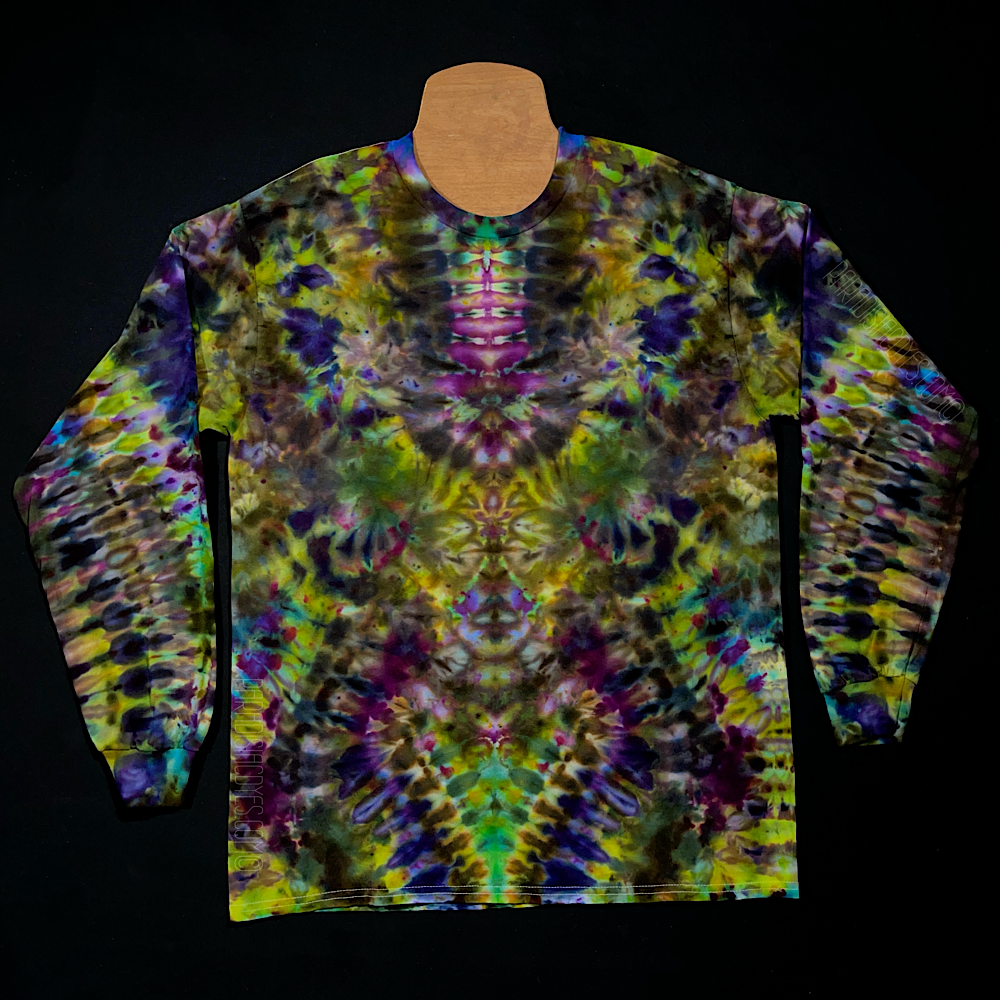 The front side of a custom handmade-to-order Psychedelic Mindscape long sleeve ice tie dyed shirt design featuring a Halloween inspired array of green & purple shades; each featuring a mesmerizing, abstract, symmetrical pattern