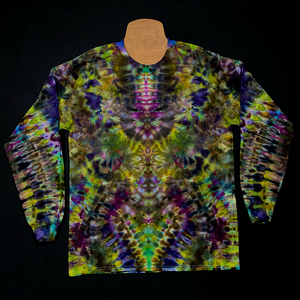 The front side of a custom handmade-to-order Psychedelic Mindscape long sleeve ice tie dyed shirt design featuring a Halloween inspired array of green & purple shades; each featuring a mesmerizing, abstract, symmetrical pattern