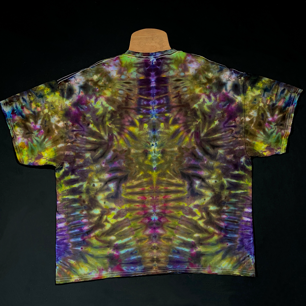 Back side of another custom, handmade-to-order Psychedelic Mindscape ice tie dyed t-shirt design in a Halloween themed green & purple color scheme, featuring an abstract, symmetrical pattern