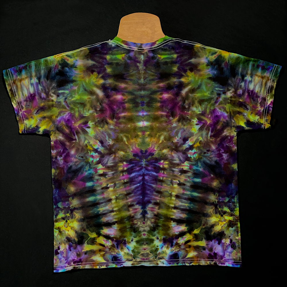 Back side of a Psychedelic Mindscape ice tie dyed shirt design in a Halloween themed green & purple color scheme; featuring an abstract, symmetrical, totem pole reminiscent pattern