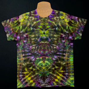 Front side of a third, different Psychedelic Mindscape ice dyed t-shirt design featuring a Halloween themed purple & green color scheme in an abstract, symmetrical, totem pole reminiscent pattern