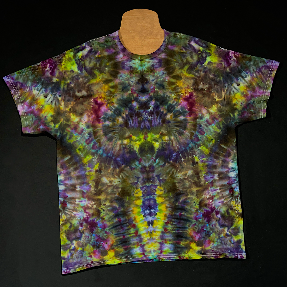 Front side of a fourth, different Psychedelic Hippieween ice tie dyed shirt design, a hand-dyed to order, abstract, symmetrical green & purple Halloween themed color scheme.