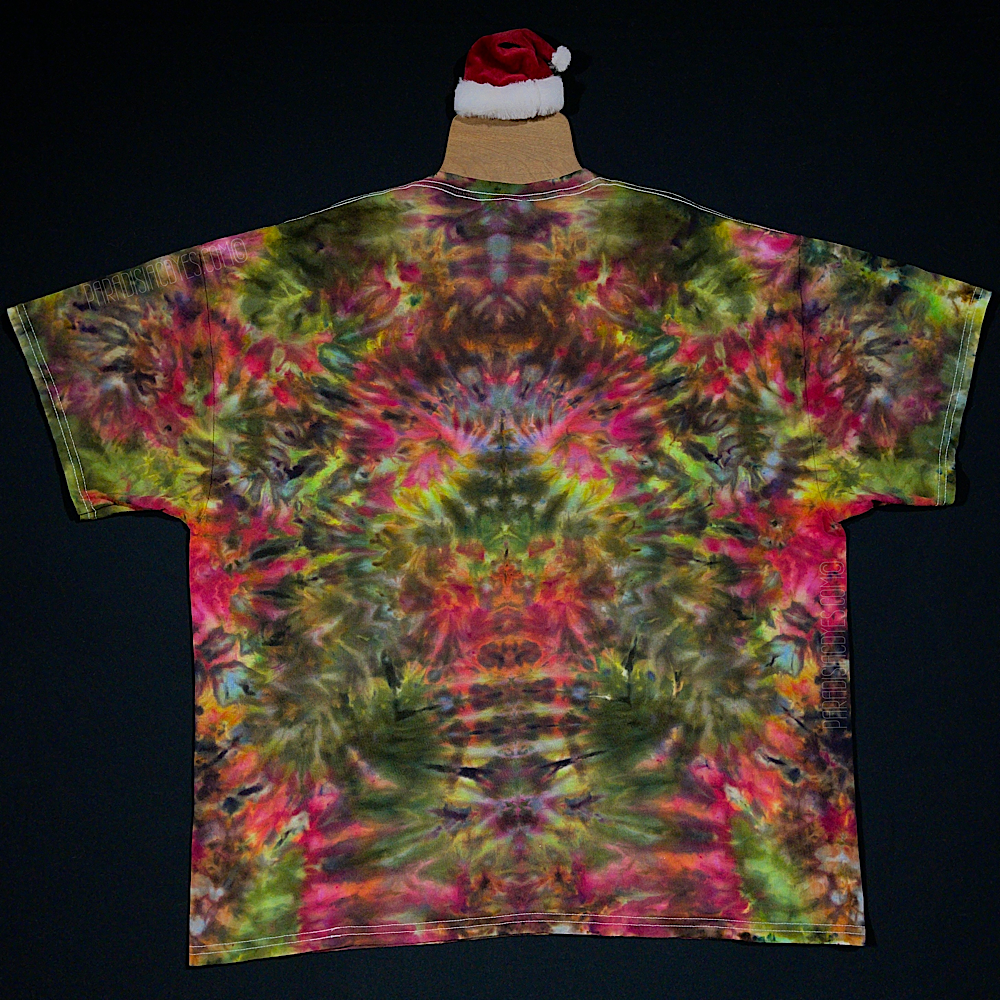 The back side of a third different custom handmade-to-order Merry Mindscape ice tie dyed shirt design. A Christmas inspired abstract, symmetrical pattern featuring a festive array of red, green & gold shades
